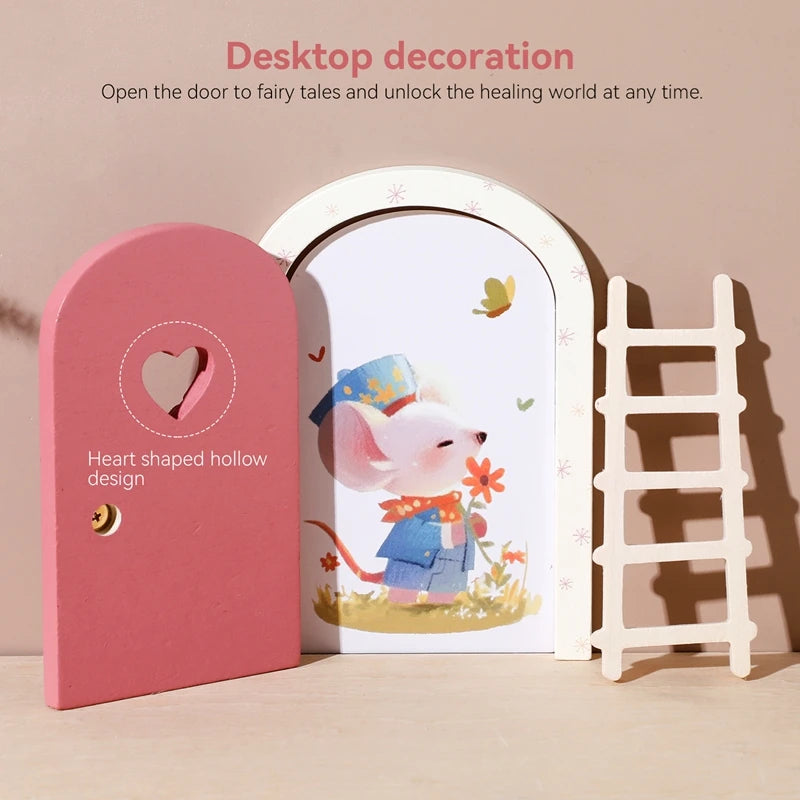 Pink door with heart-shaped hollow design, white archway with cartoon mouse, and white ladder on a beige background.